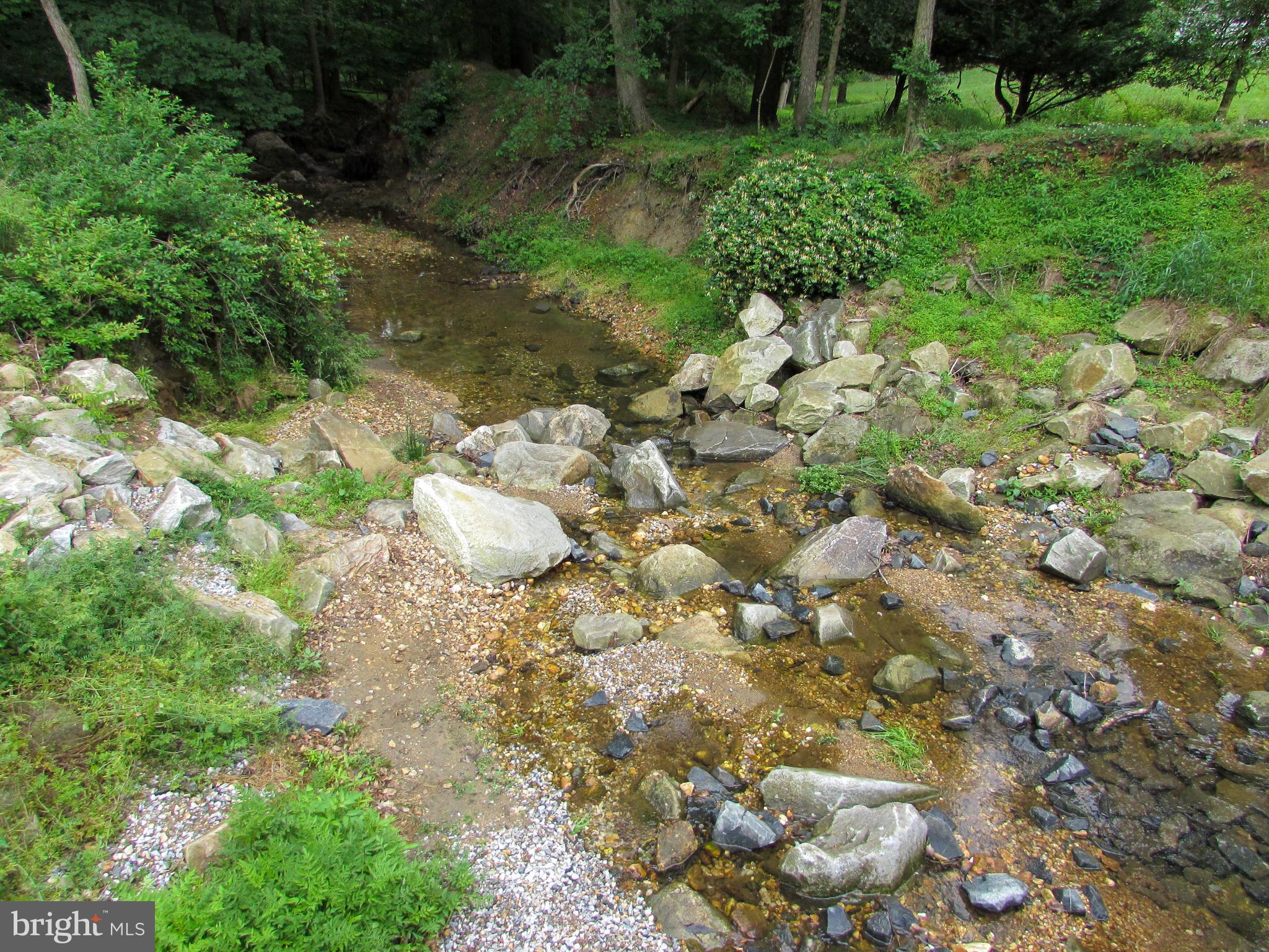 4729 Roundhill Road Ellicott City, MD 21043 - Photo 42 of 48 COMMUNITY STREAM LEADS TO OLD ELLICOTT CITY