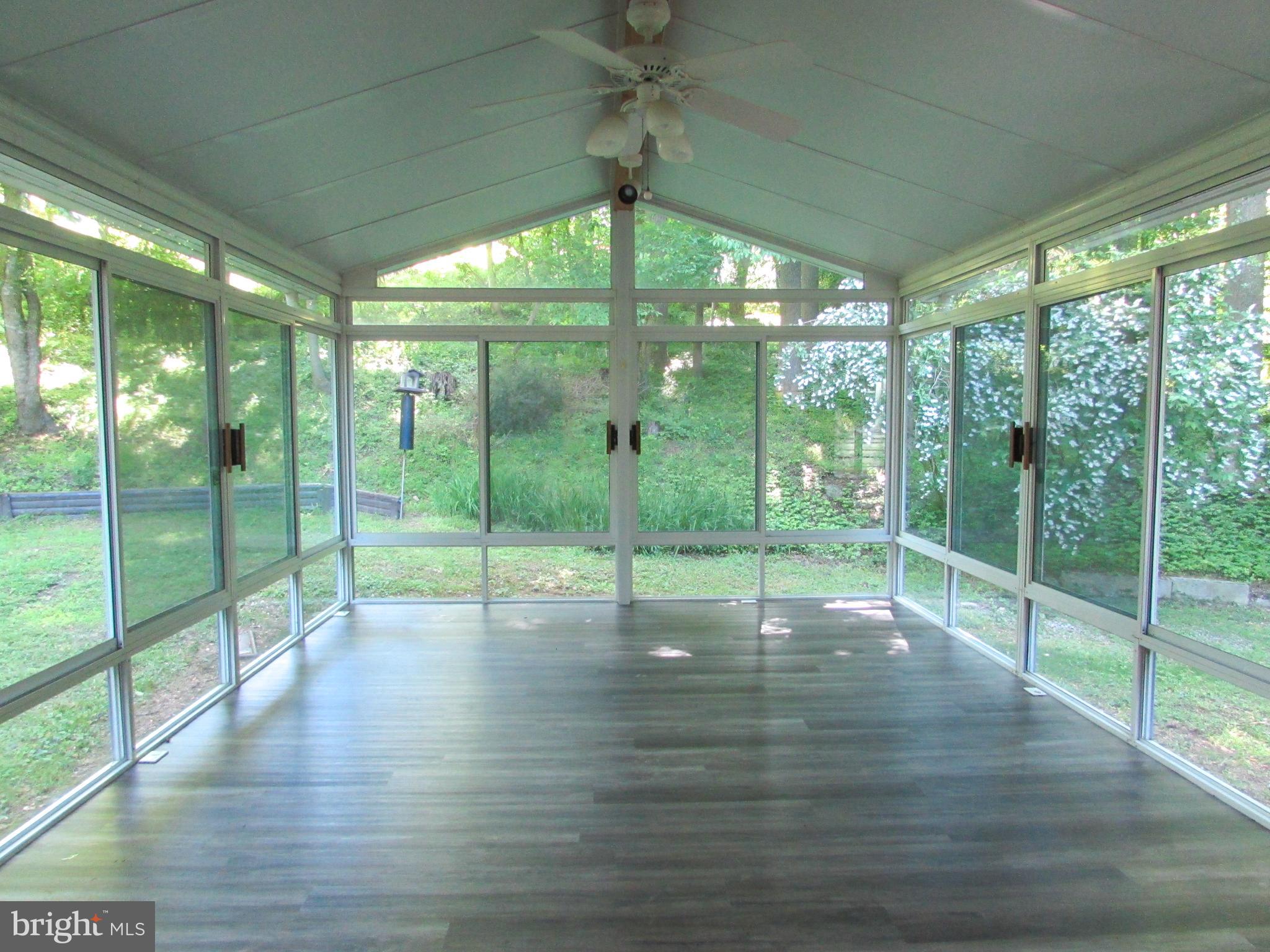 4729 Roundhill Road Ellicott City, MD 21043 - Photo 7 of 48 VIEW OF SUNROOM FROM KITCHEN