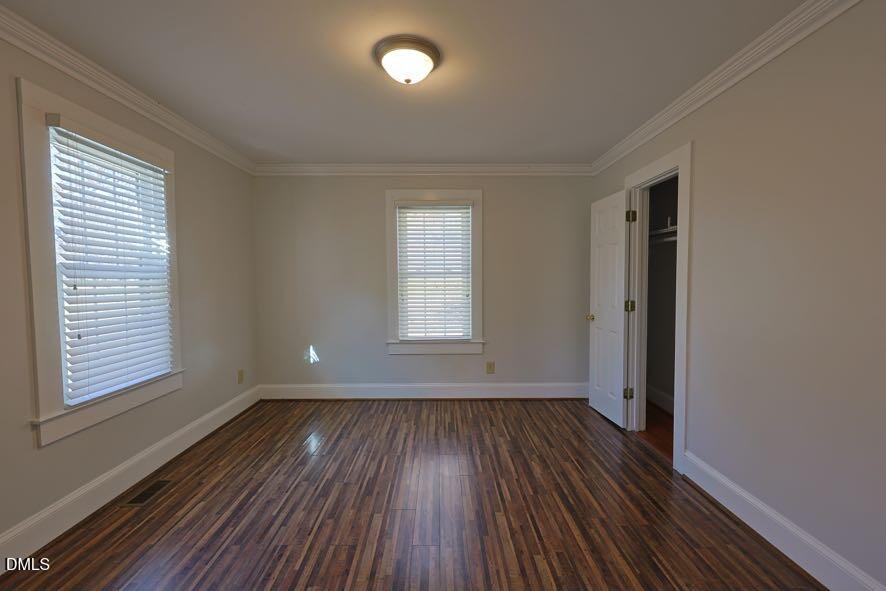 536 Oakgrove Road Asheboro, NC 27205 - Photo 12 of 36 an empty room with wooden floor and windows