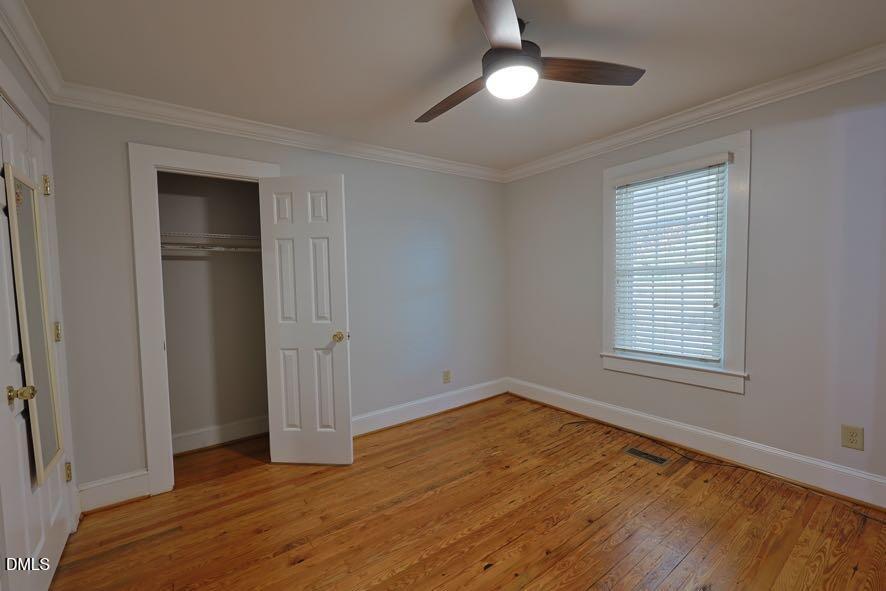 536 Oakgrove Road Asheboro, NC 27205 - Photo 16 of 36 a view of an empty room with wooden floor and a window