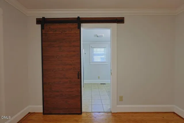 a view of front door with wooden floor