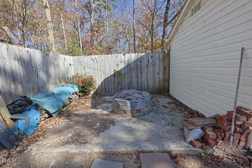 536 Oakgrove Road Asheboro, NC 27205 - Photo 29 of 36 a view of a backyard with a large tree and wooden fence