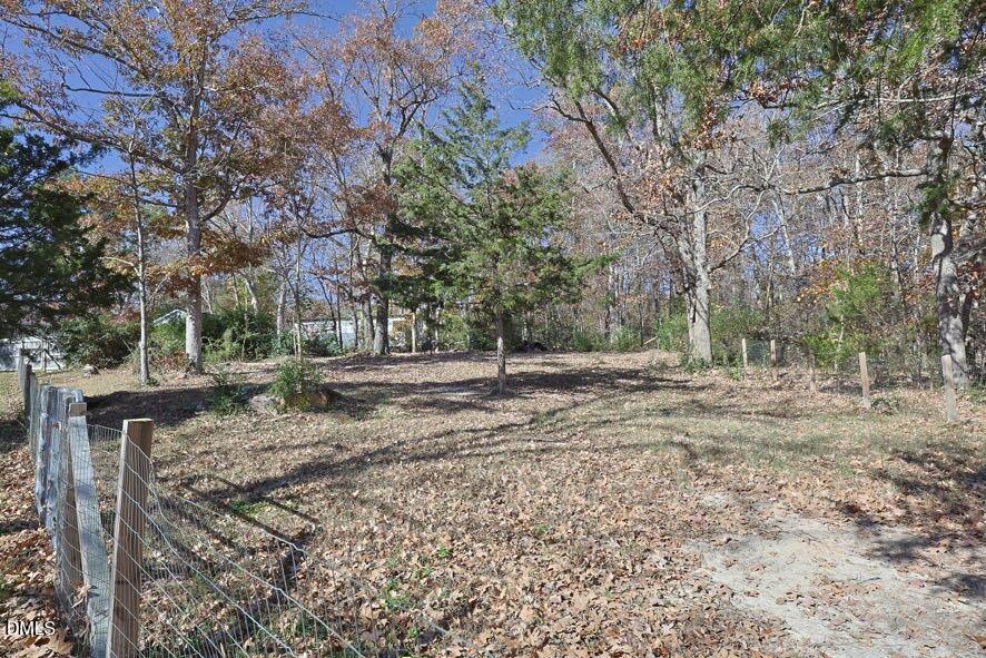 536 Oakgrove Road Asheboro, NC 27205 - Photo 32 of 36 a view of a tree in the middle of a yard