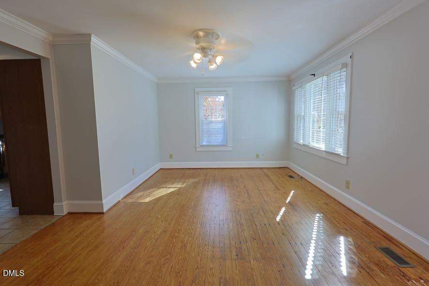 536 Oakgrove Road Asheboro, NC 27205 - Photo 5 of 36 an empty room with wooden floor and windows