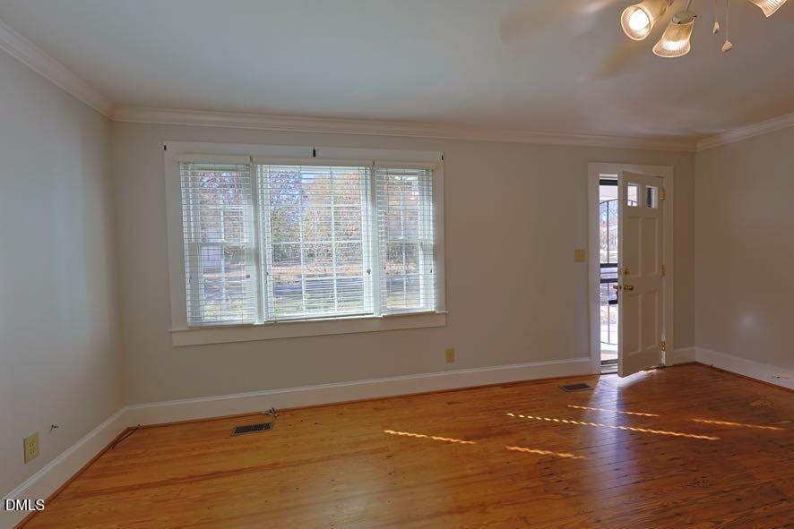 536 Oakgrove Road Asheboro, NC 27205 - Photo 6 of 36 an empty room with wooden floor and windows