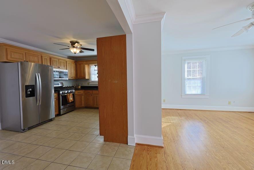 536 Oakgrove Road Asheboro, NC 27205 - Photo 7 of 36 a kitchen with stainless steel appliances a refrigerator and wooden cabinets