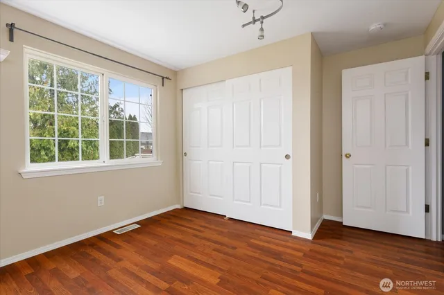 a view of a chair and table on the wooden deck