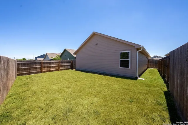 a view of a backyard with a small cabin