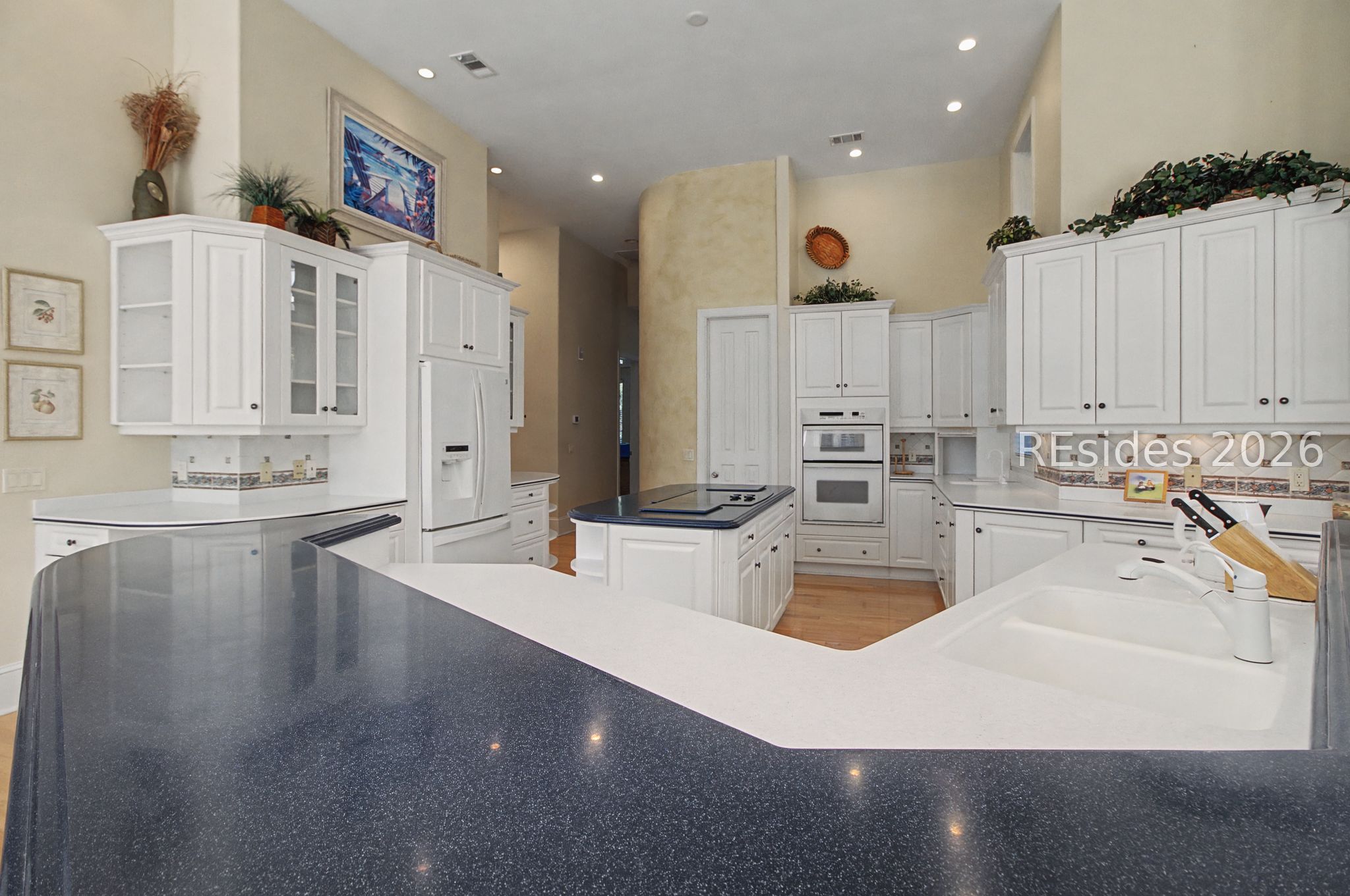 88 Inverness Drive Bluffton, SC 29910 - Photo 19 of 47 Kitchen with center island and breakfast bar.