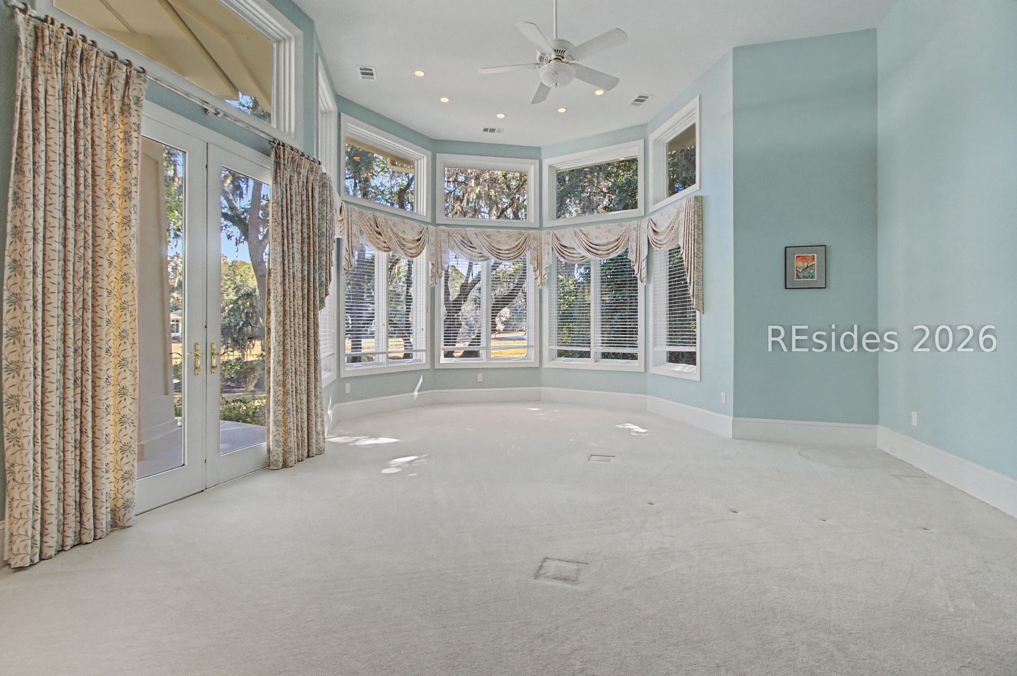 88 Inverness Drive Bluffton, SC 29910 - Photo 24 of 47 Grand owners suite with doors out to patio.