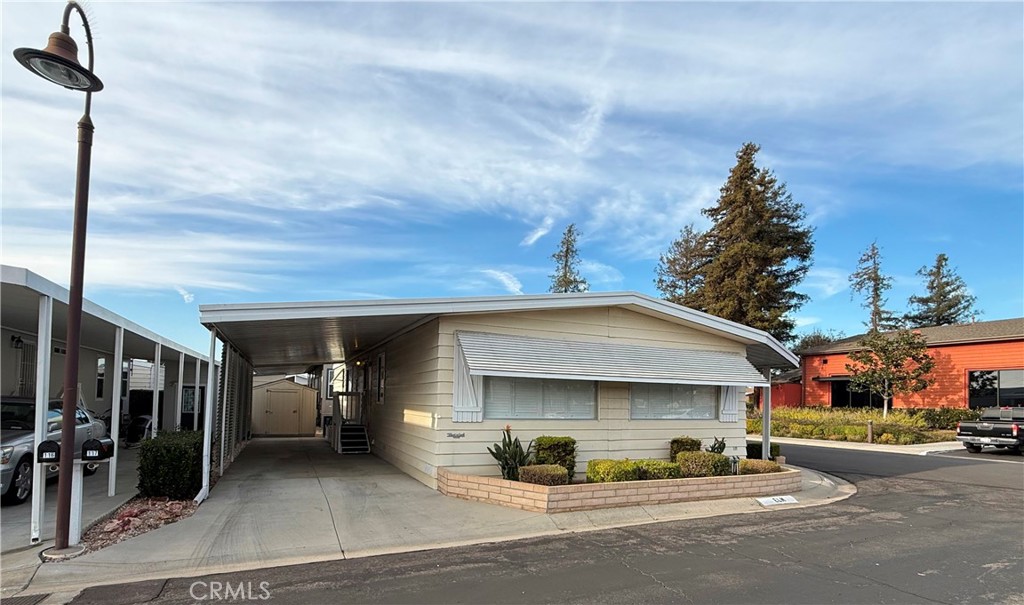 14851 Jeffrey Road, Unit 117 Irvine, CA 92618 - Photo 2 of 45 a view of a car park in front of house