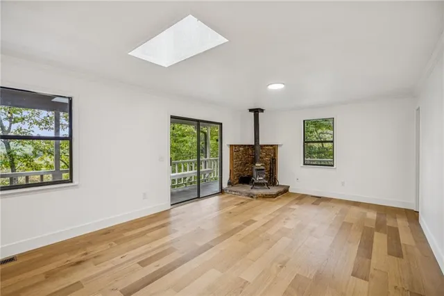 a view of a livingroom with a flat screen tv and windows