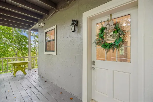 a view of hallway with wooden floor