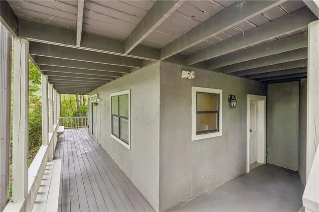 a view of an empty room with a window