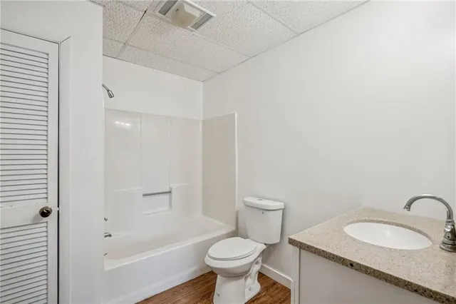 a view of an outdoor space with wooden fence