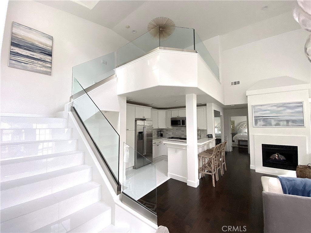 40 Anjou Newport Coast, CA 92657 - Photo 11 of 33 a living room with furniture and a fireplace