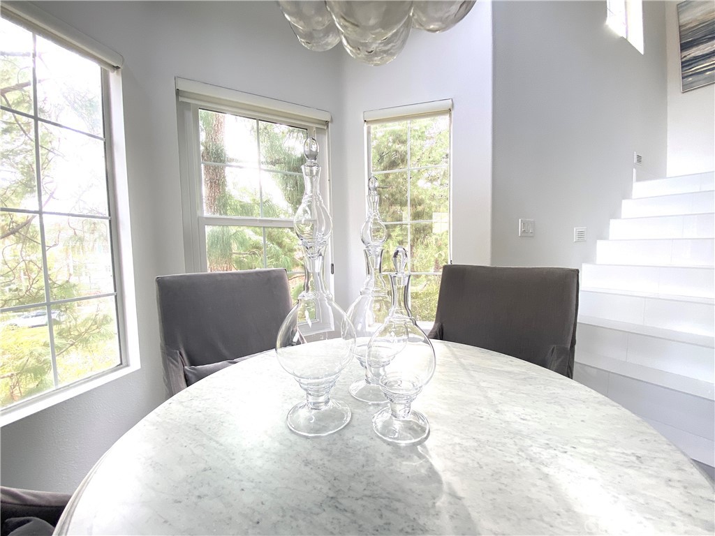 40 Anjou Newport Coast, CA 92657 - Photo 12 of 33 a large white bed sitting in a bedroom next to a window