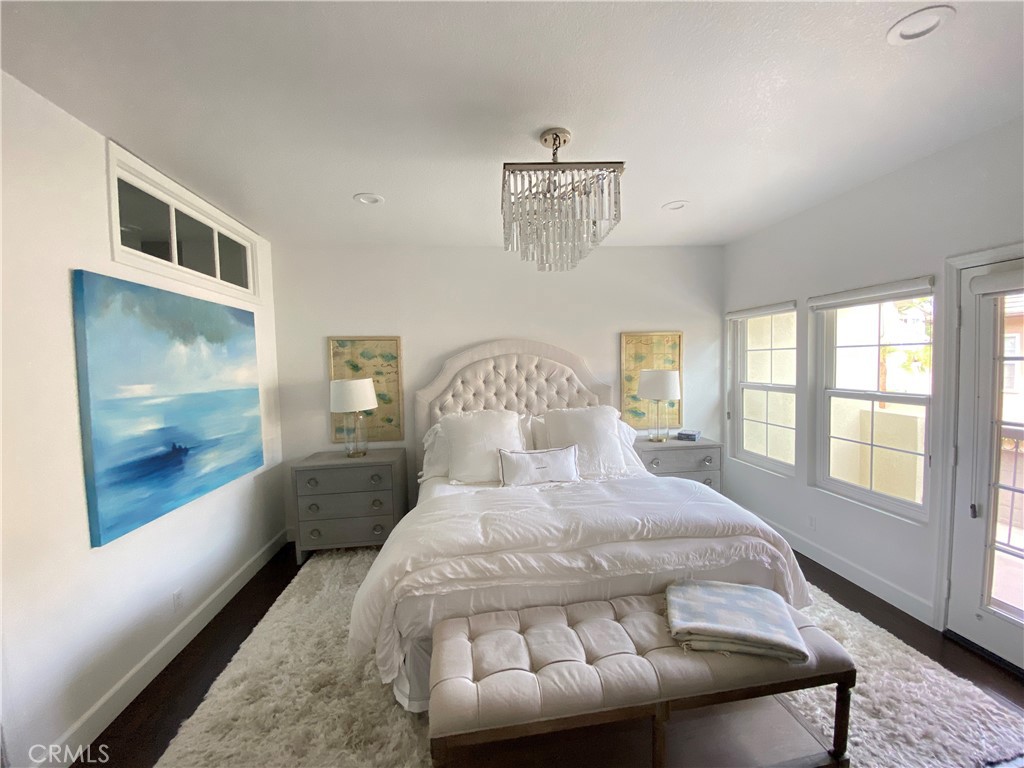 40 Anjou Newport Coast, CA 92657 - Photo 15 of 33 a large bed sitting in a bedroom next to a window