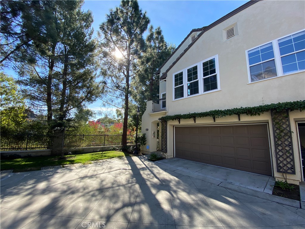 40 Anjou Newport Coast, CA 92657 - Photo 33 of 33 a front view of a house with a yard and garage