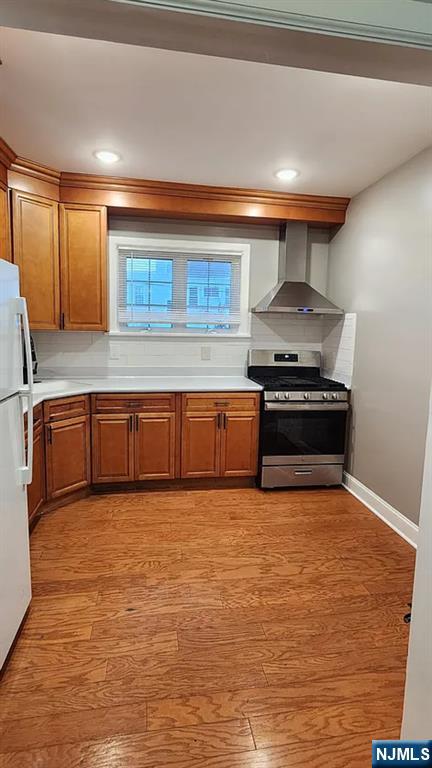 258 Franklin Street, Unit 1 Bloomfield, NJ 07003 - Photo 4 of 23 a kitchen with stainless steel appliances granite countertop a sink stove and cabinets