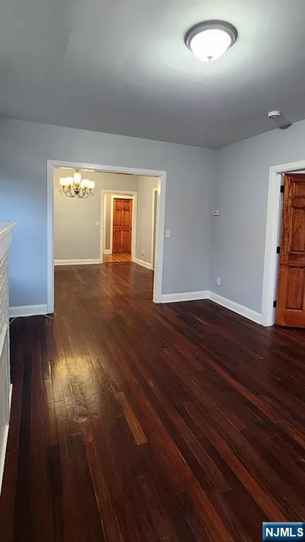258 Franklin Street, Unit 1 Bloomfield, NJ 07003 - Photo 7 of 23 an empty room with wooden floor and windows