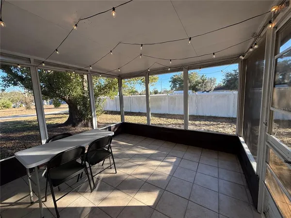 a view of a patio with a table chairs and a patio
