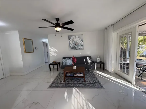 a living room with furniture and a window