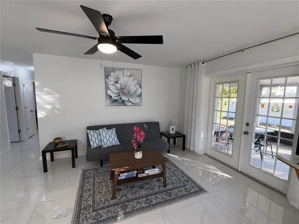 a living room with furniture and a window