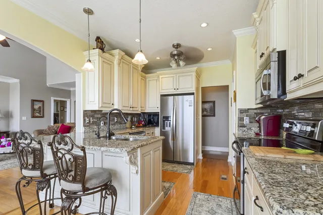 a kitchen with lots of counter top space and appliances