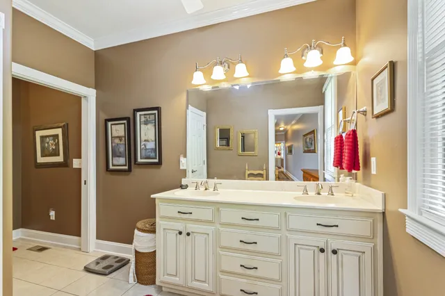 a white toilet sitting next to a bathroom sink