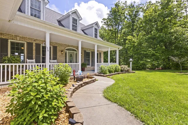 a view of a big yard with lots of green space and mountain view