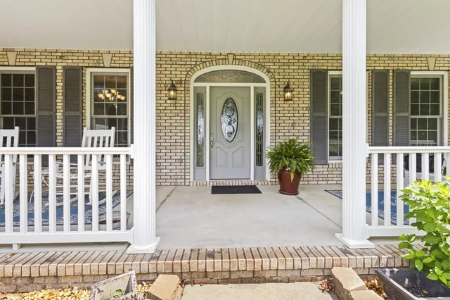 a view of balcony with wooden floor and fence