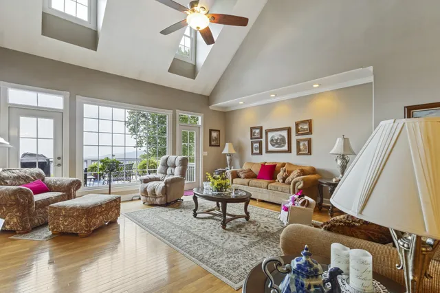 a living room with furniture fireplace and flat screen tv