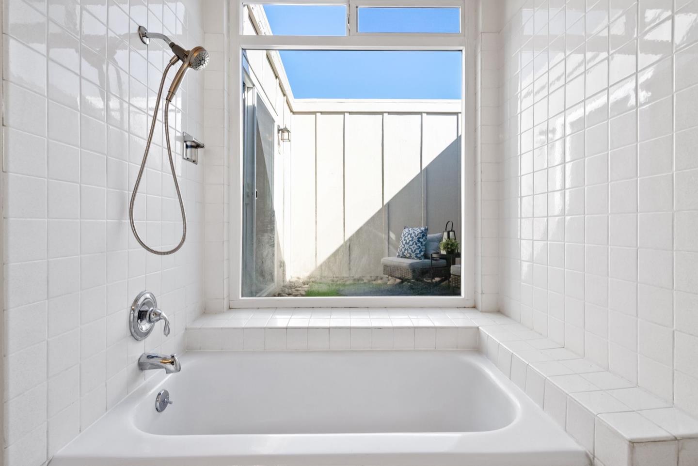 76 Jim Elder Drive Campbell, CA 95008 - Photo 18 of 37 a bathroom with a white bath tub sitting next to a window