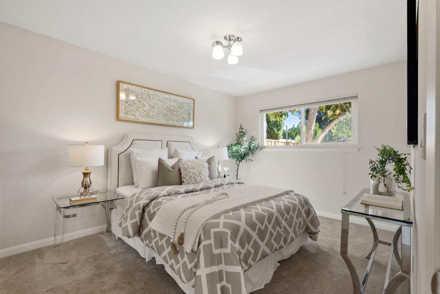 76 Jim Elder Drive Campbell, CA 95008 - Photo 19 of 37 a bedroom with bed and a painting on the wall