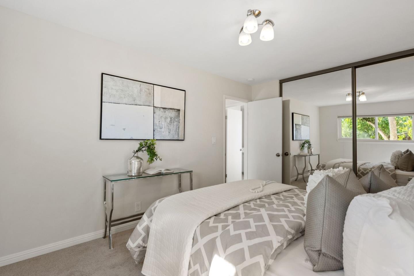 76 Jim Elder Drive Campbell, CA 95008 - Photo 20 of 37 a bedroom with a bed mirror and a window