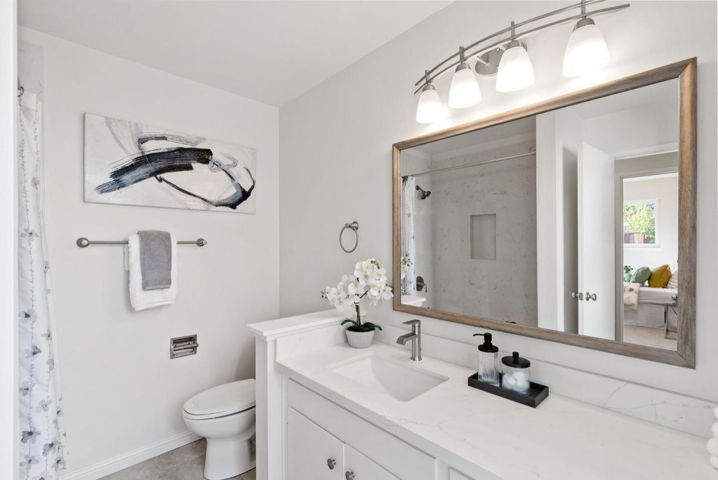 76 Jim Elder Drive Campbell, CA 95008 - Photo 25 of 37 a bathroom with a sink and a mirror