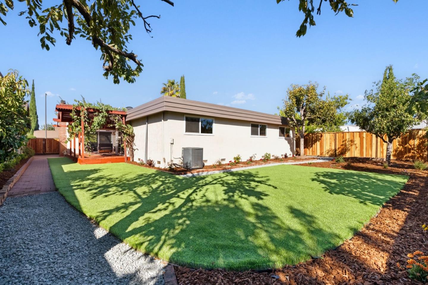 76 Jim Elder Drive Campbell, CA 95008 - Photo 30 of 37 a view of a backyard with plants and a garden