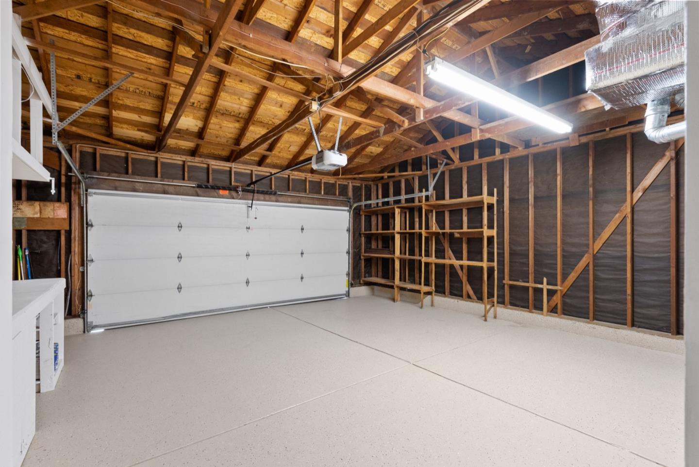 76 Jim Elder Drive Campbell, CA 95008 - Photo 31 of 37 a view of an empty room with wooden shelves