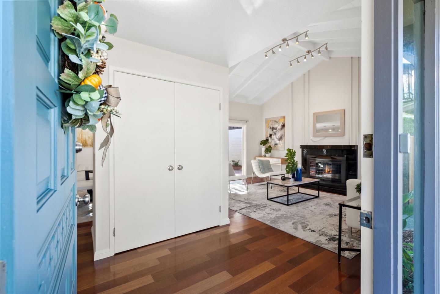 76 Jim Elder Drive Campbell, CA 95008 - Photo 4 of 37 a living room with furniture a chandelier and a fireplace