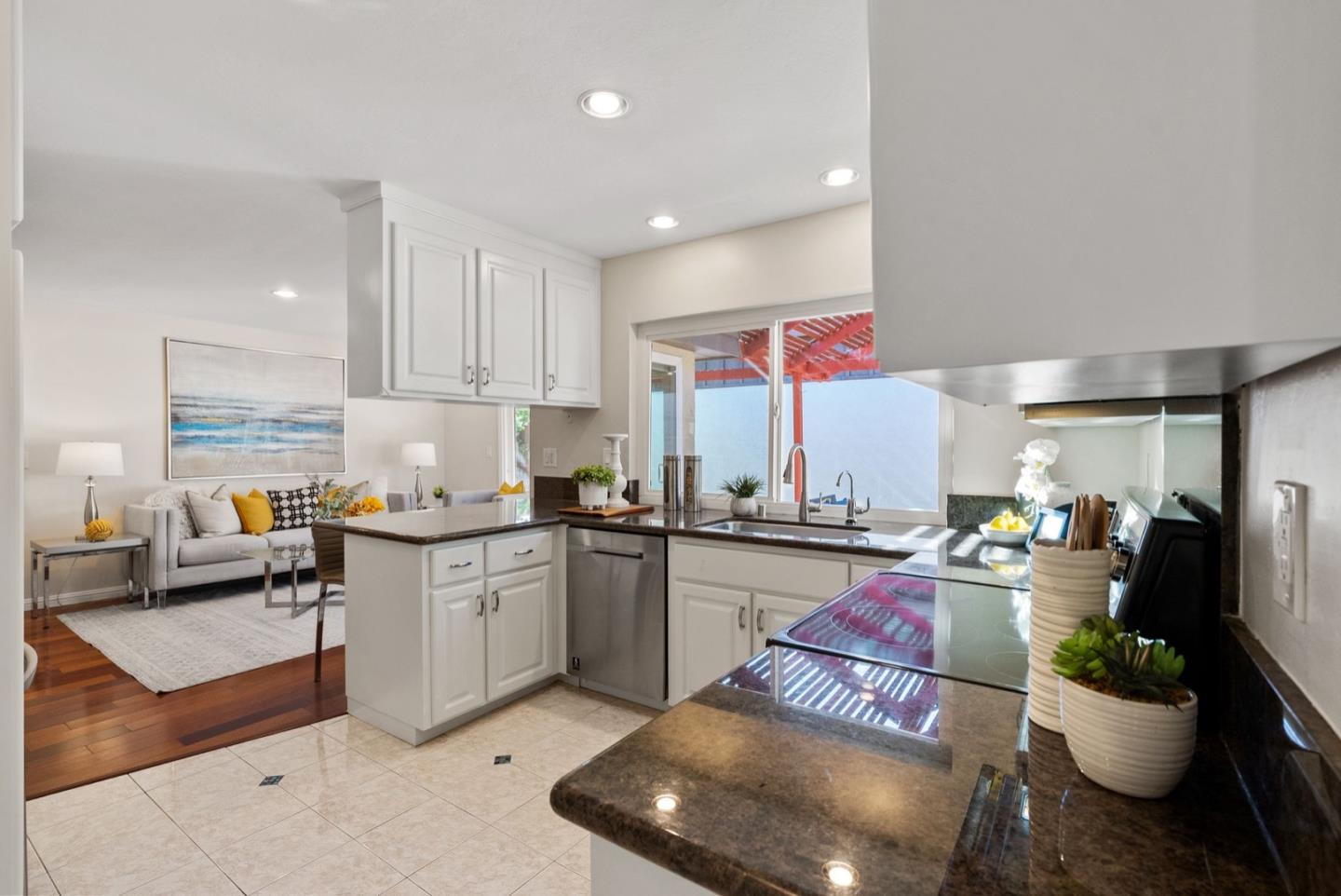 76 Jim Elder Drive Campbell, CA 95008 - Photo 9 of 37 a kitchen with stainless steel appliances granite countertop a sink dishwasher stove and cabinets