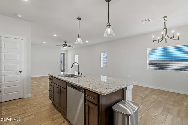 a kitchen with sink cabinets and window