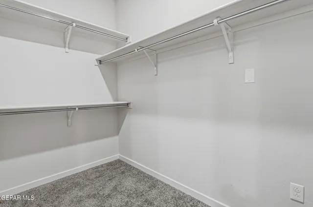 a view of a storage and utility room with closet