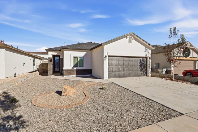 a view of a house with a snow on the road