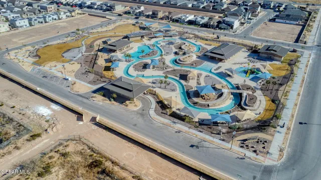 an aerial view of residential houses with outdoor space