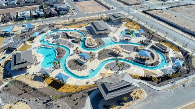 an aerial view of a couch and table in a patio
