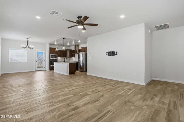 a view of a kitchen with a sink and a window