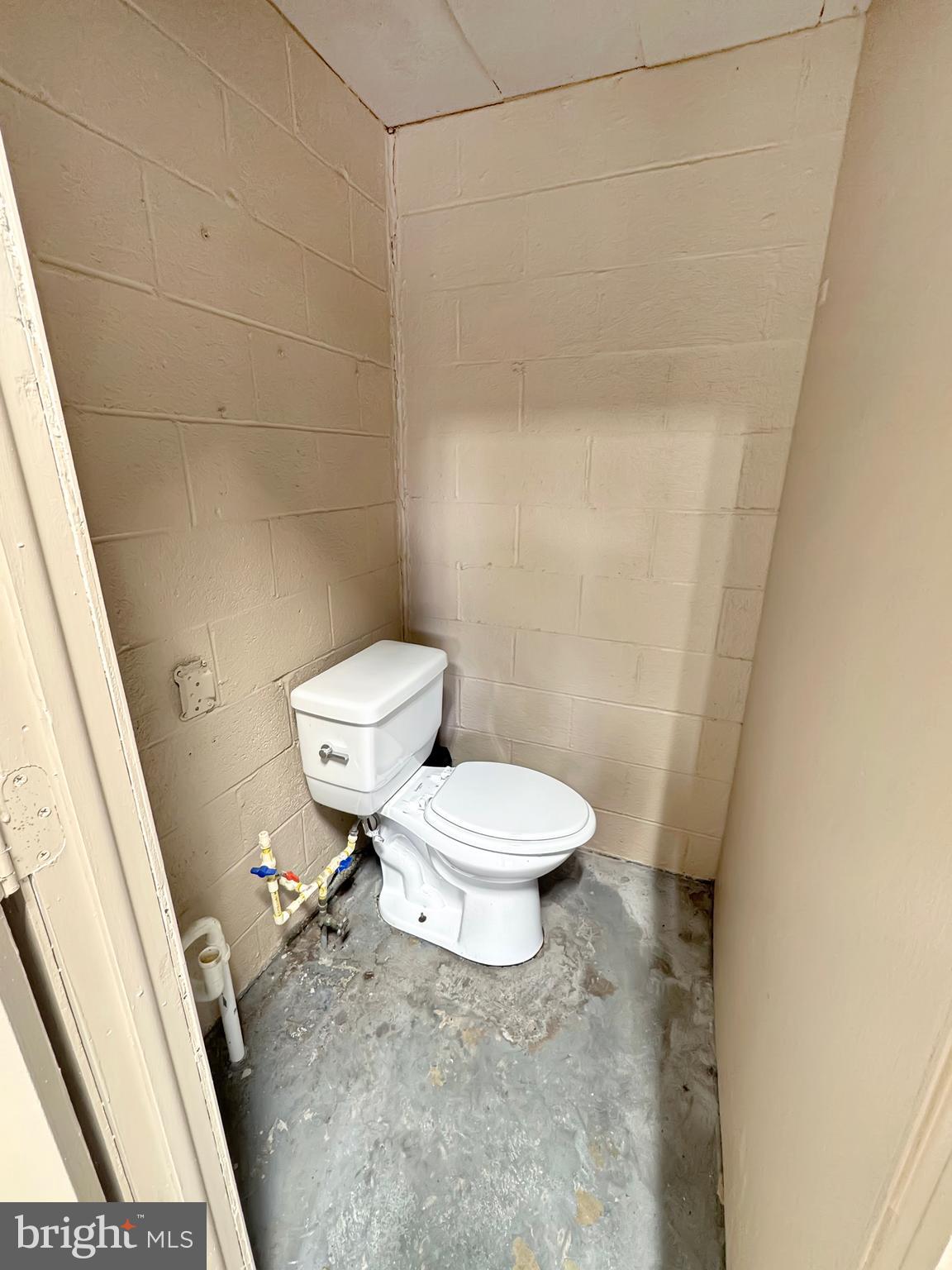1027 Riverside Drive Pottstown, PA 19465 - Photo 24 of 24 a white toilet sitting next to a shower