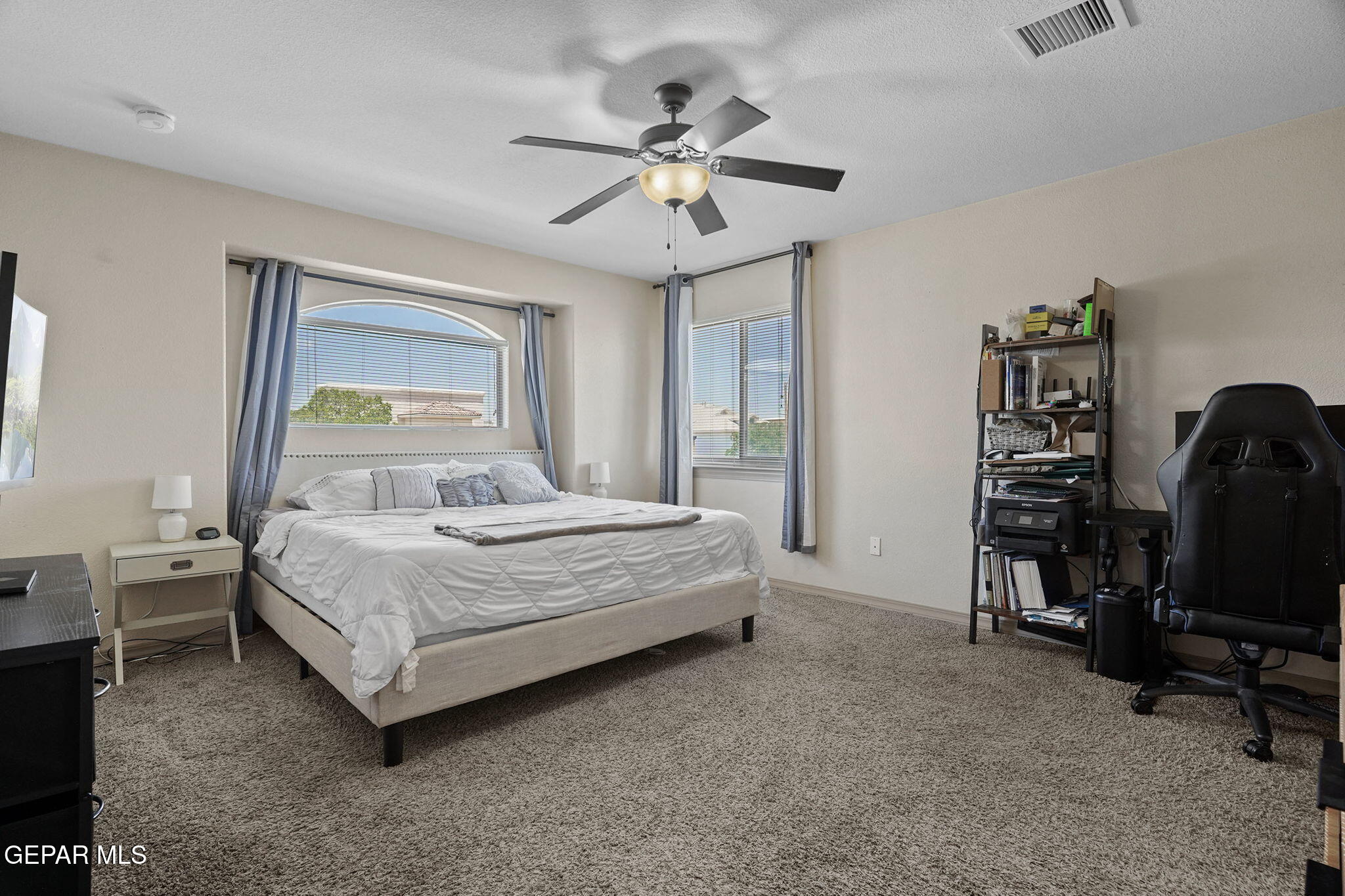3152 Rustic Hidden Drive El Paso, TX 79938 - Photo 18 of 38 a bedroom with a bed and a chandelier