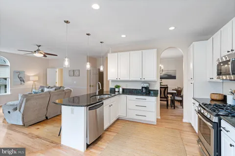 a living room with furniture fireplace and a flat screen tv